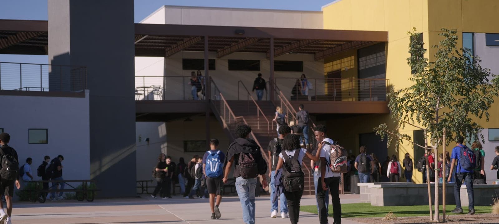 Highland Prep West campus entrance with students arriving
