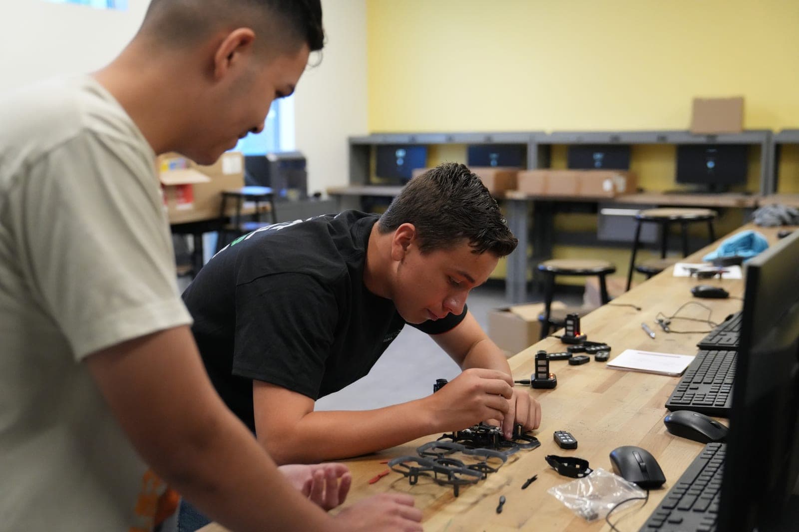 A Highland Prep West student working at an electronics workbench