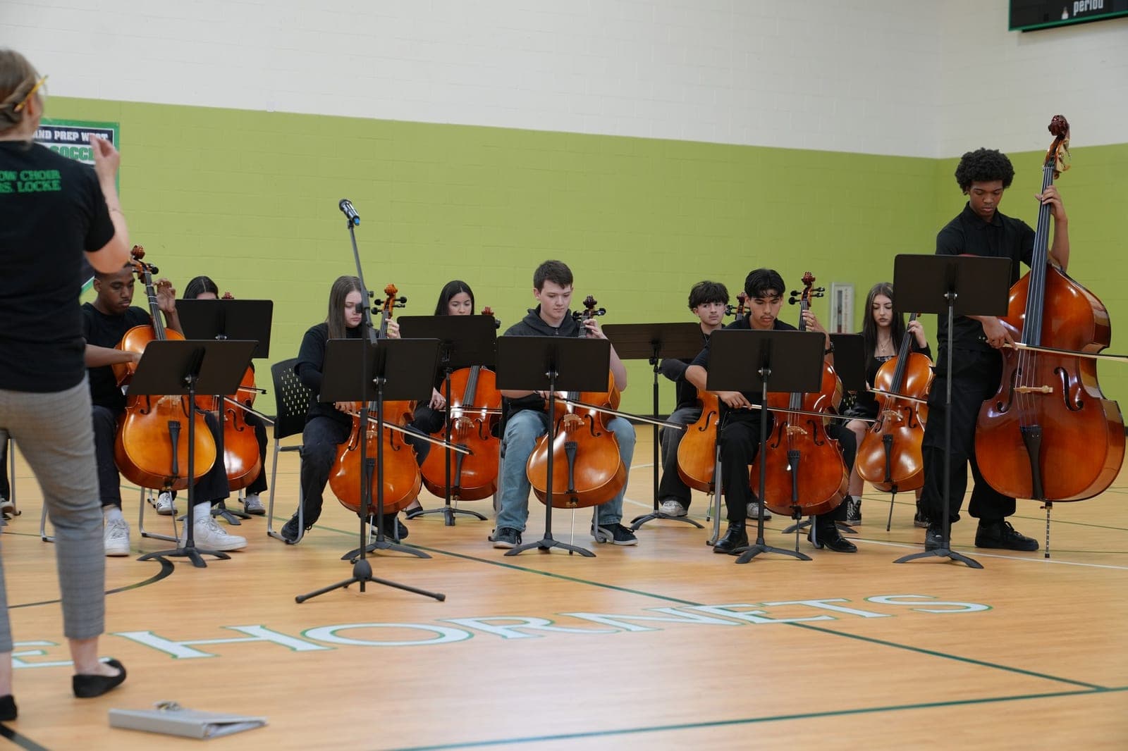 Highland Prep West orchestra and strings students rehearsing
